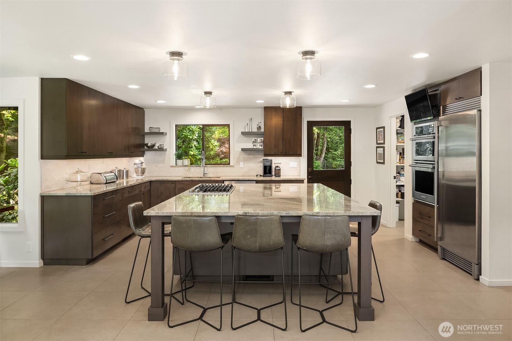 Off the kitchen is a walk-in pantry with built-in shelving for your additional storage needs.