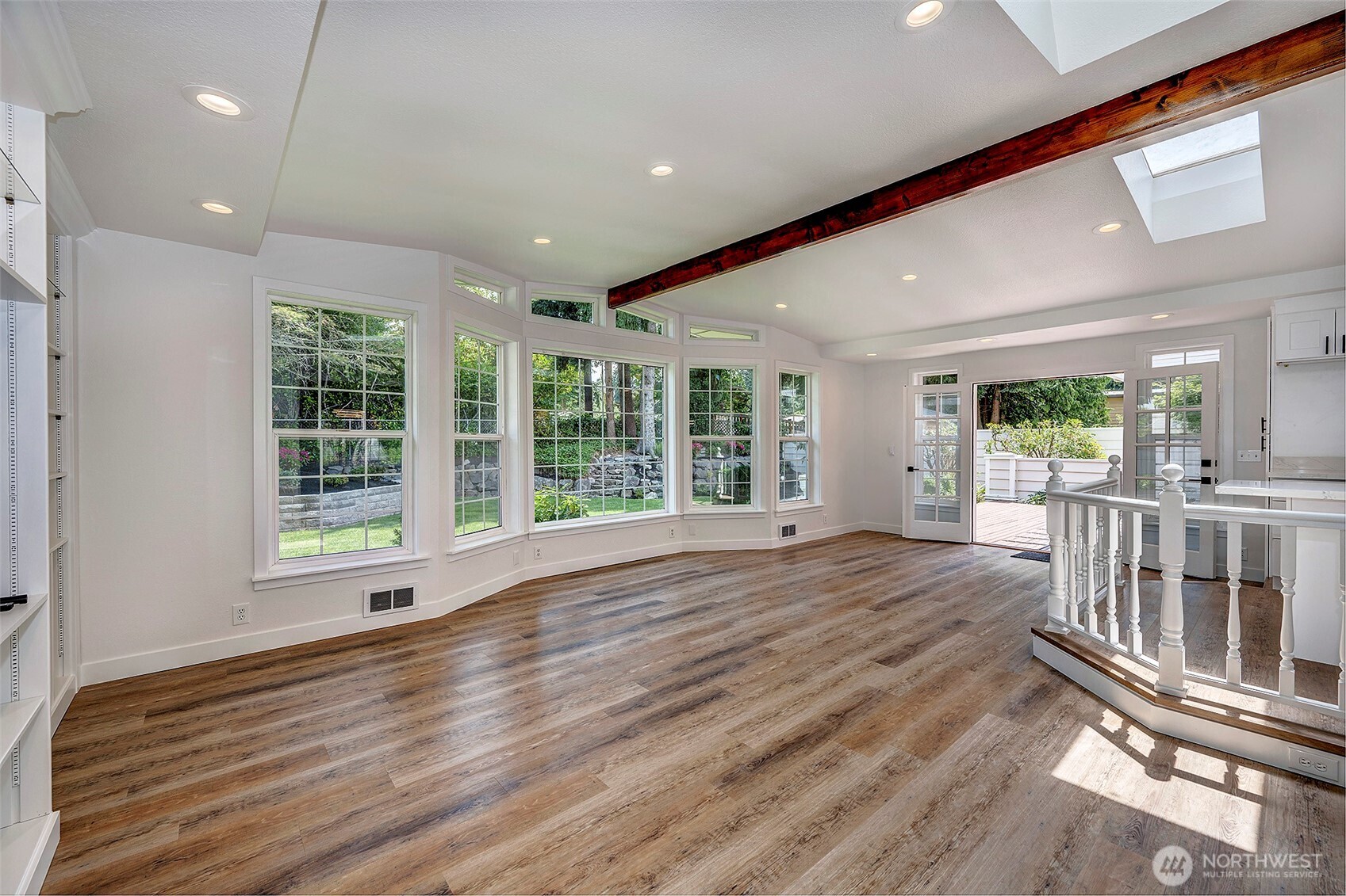 Great room with new LVP flooring and paint