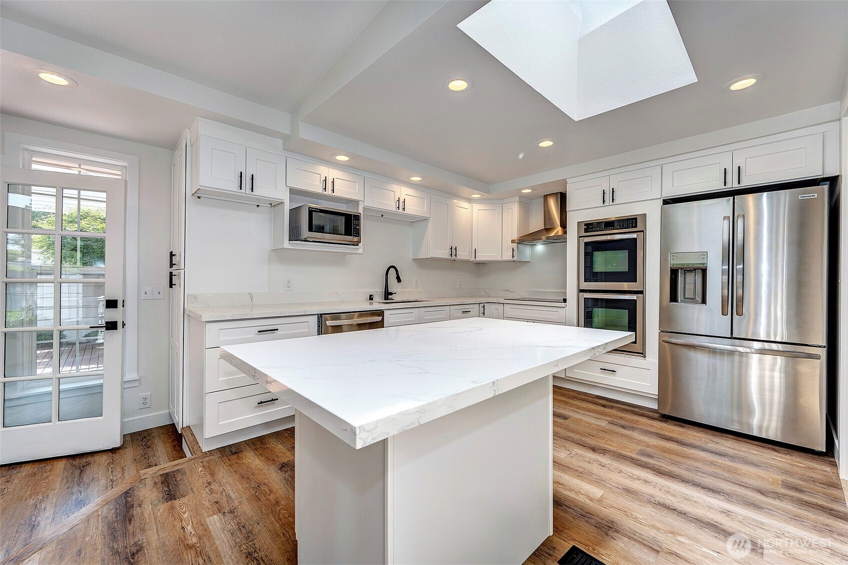 New cabinets and appliances, plus LVP flooring