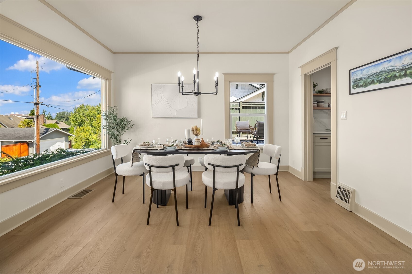 Large dining room with space for your over sized table. This table is 6 Ft and there is space for longer