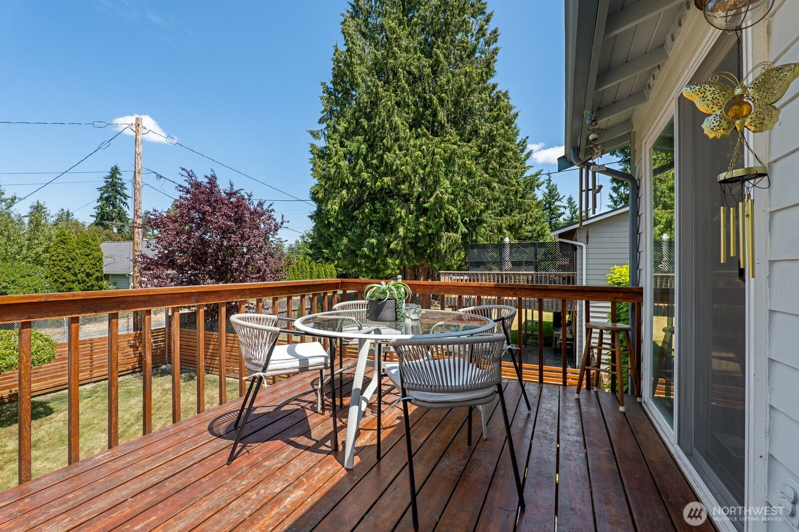 Spacious deck off of the dining room overlooks the huge backyard.