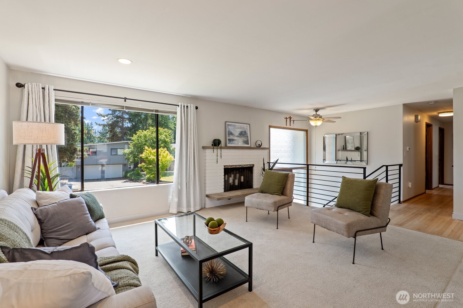 Inviting living room with wood burning fireplace.