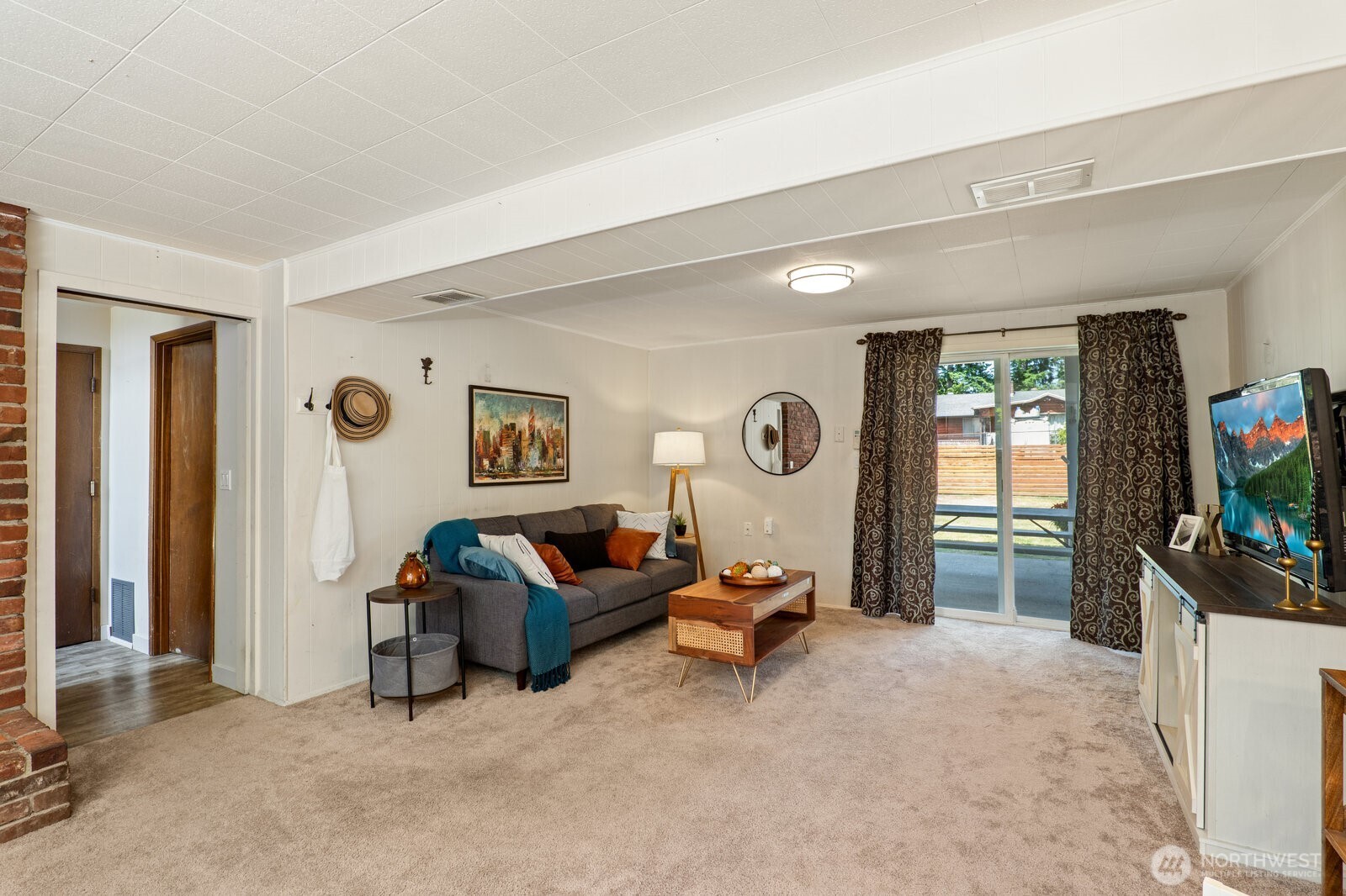 Family room opens out to the patio and huge backyard.