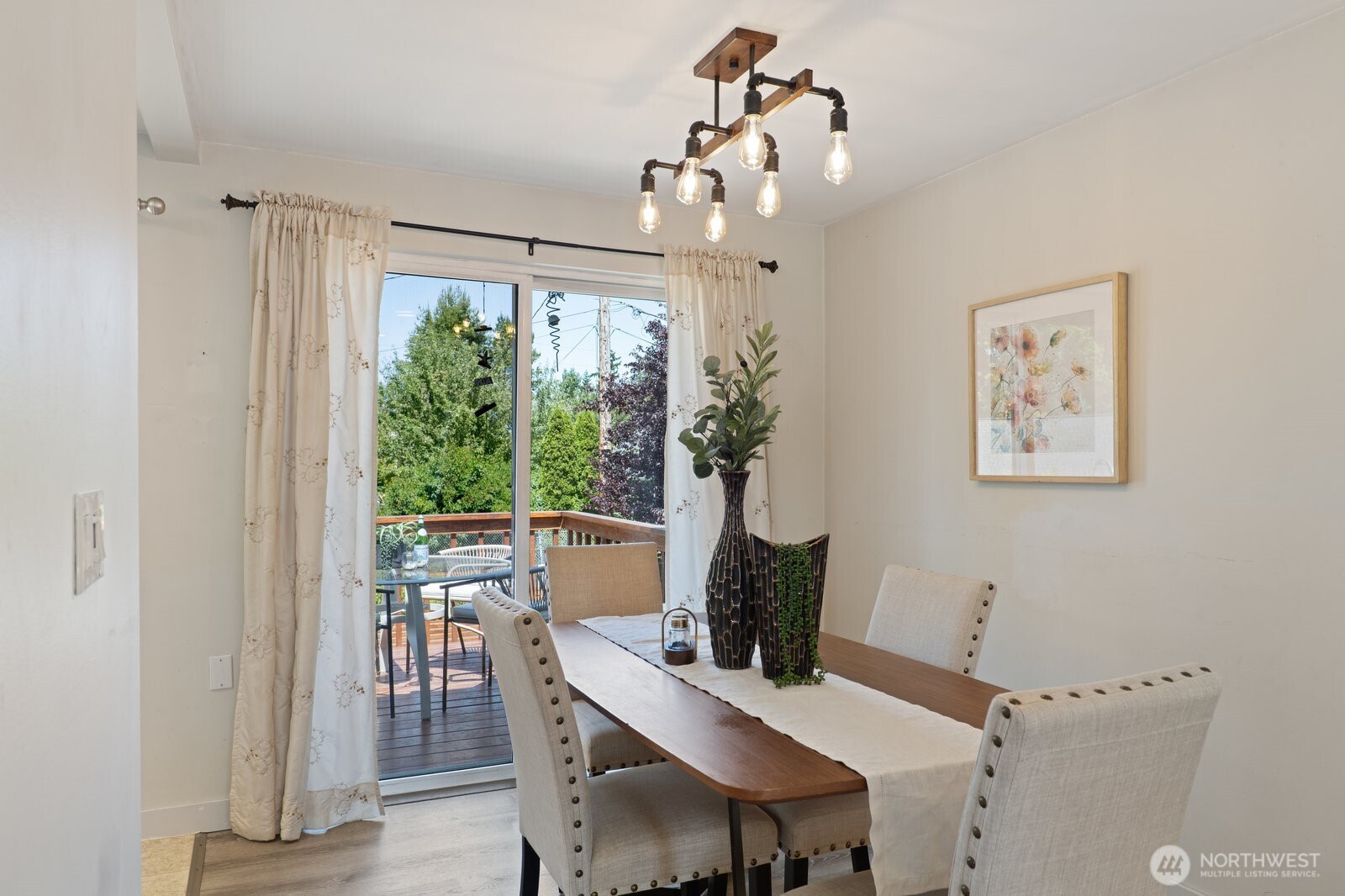 Dining room flows out to the deck and into the kitchen.