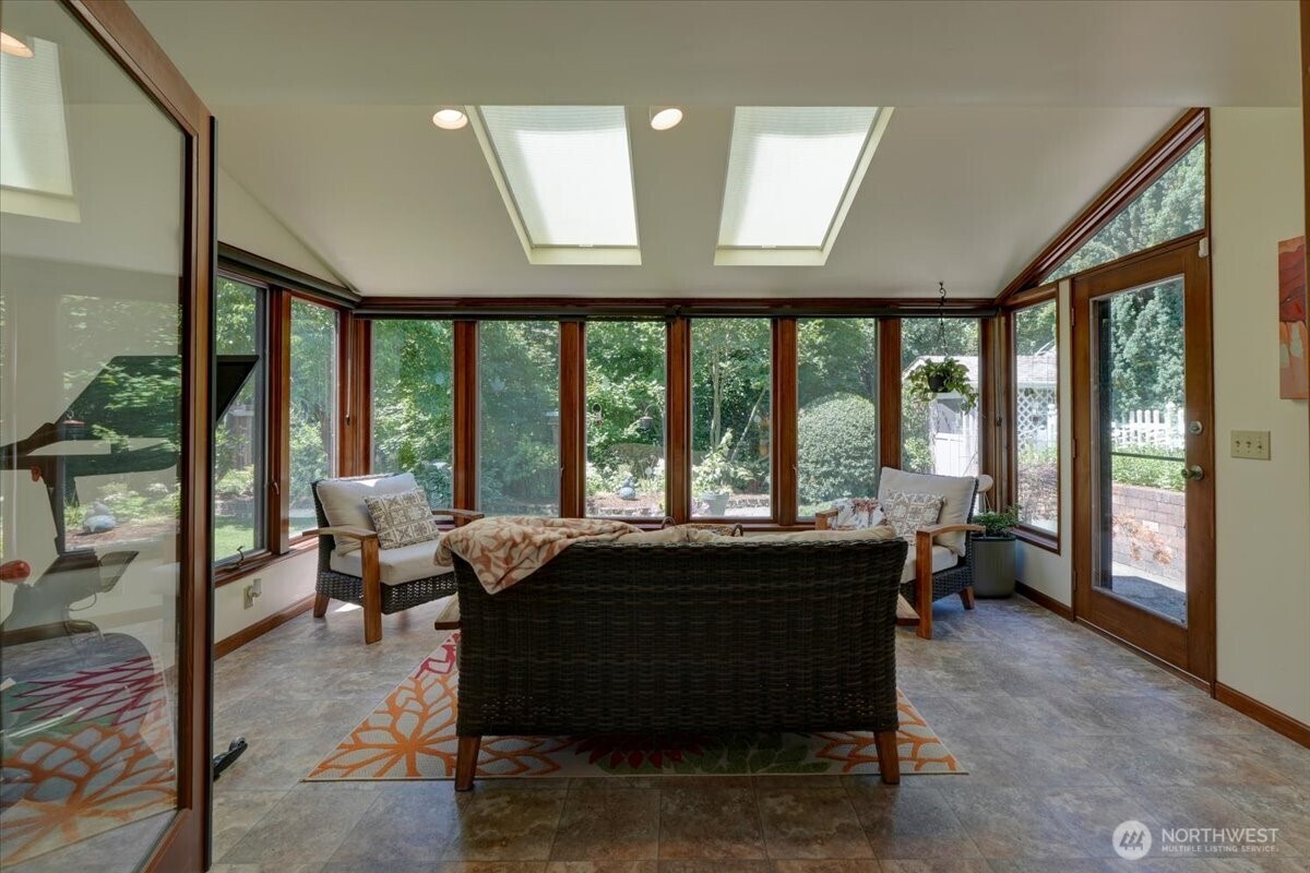WOW! Beautiful sunroom to observe the backyard and nature with access to the back yard and patio.