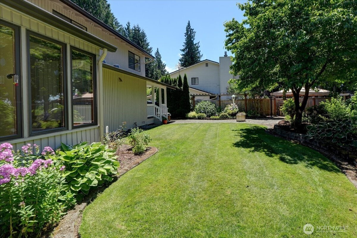View of backyard from just outside the sun room looking south.