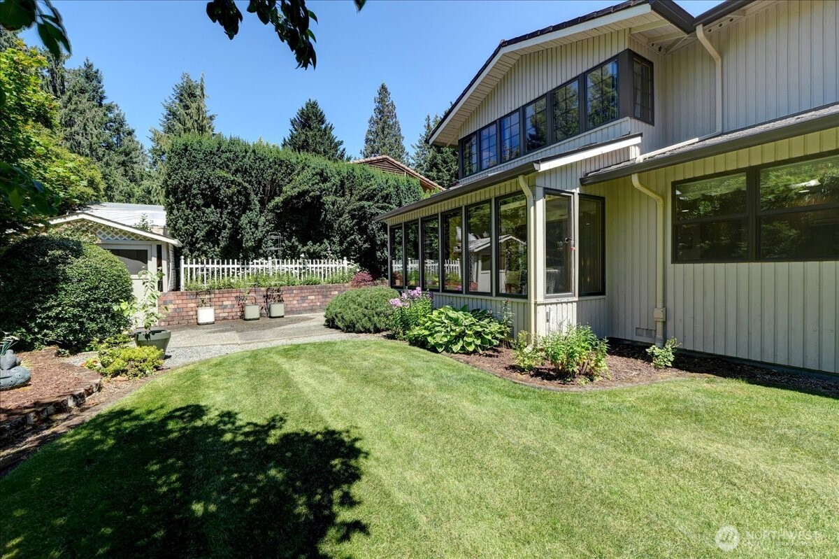 Partial view of gorgeous manicured backyard.