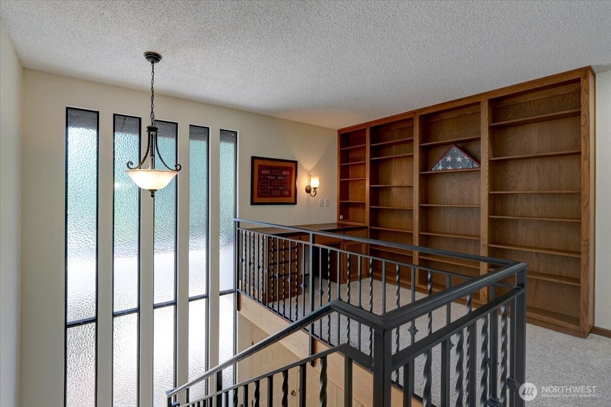 Upstairs loft with built ins would make a great reading area!