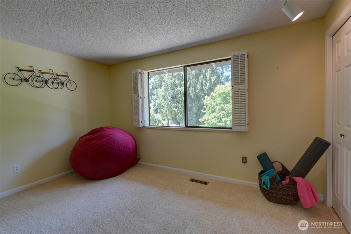 Bedroom 3 also overlooks the back yard and greenbelt.
