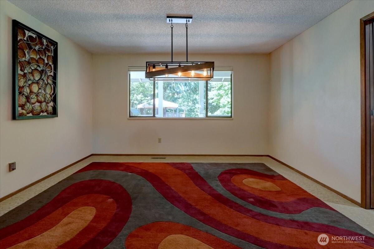 Dining room overlooking the back deck and yard.
