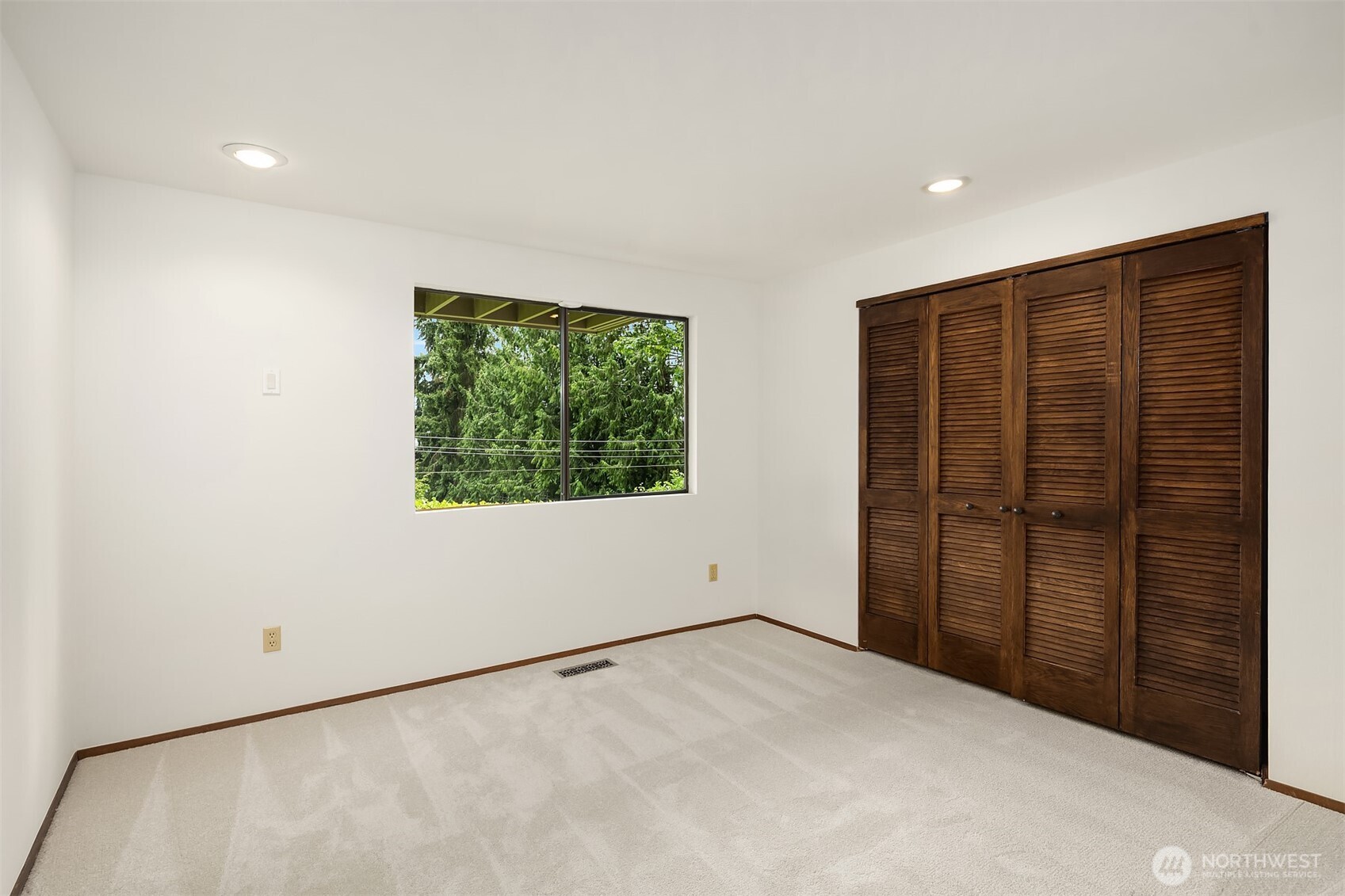 Three additional bedrooms are together on the lower level.