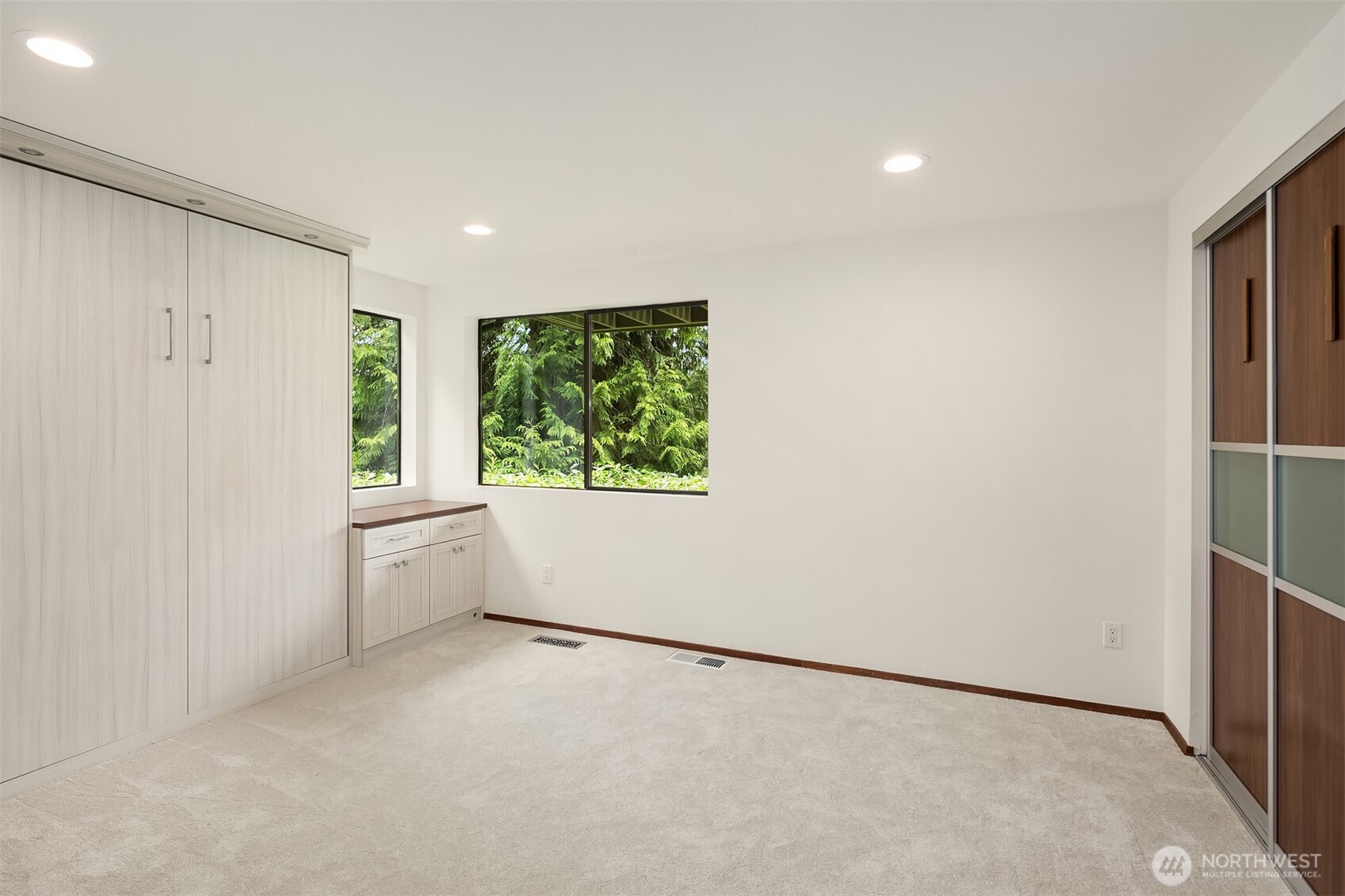 Third downstairs bedrooms with more custom built-ins.