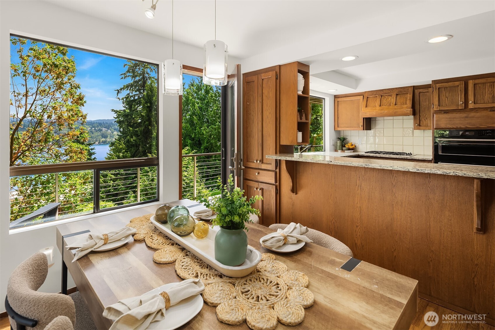 Nearly every window frames lush greenery, views of the lake, & blooming rhododendrons in spring.
