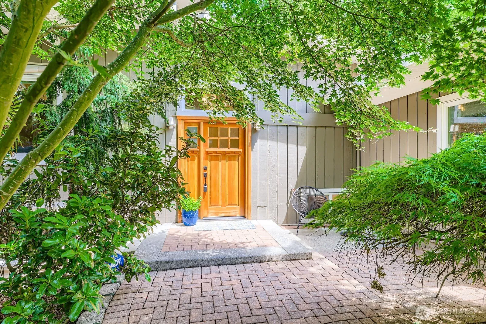 Set among large trees on a quiet street, this home offers privacy