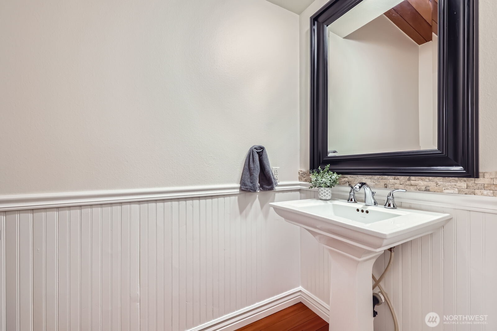 Half bathroom located off the kitchen.