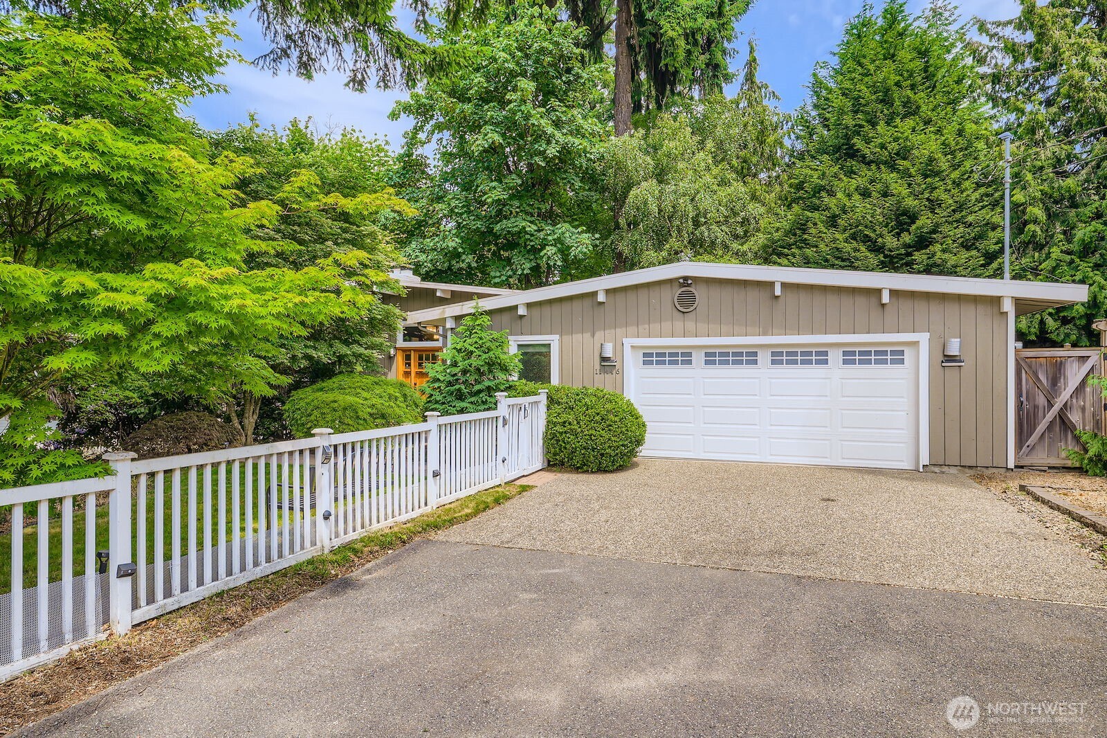 The garage has two car side-by-side parking, plus a third tandem space