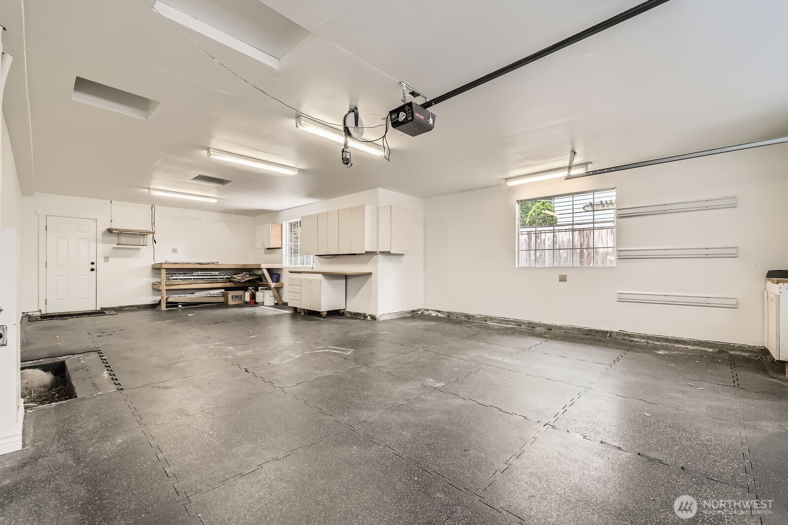 The garage has two car side-by-side parking, plus a third tandem space