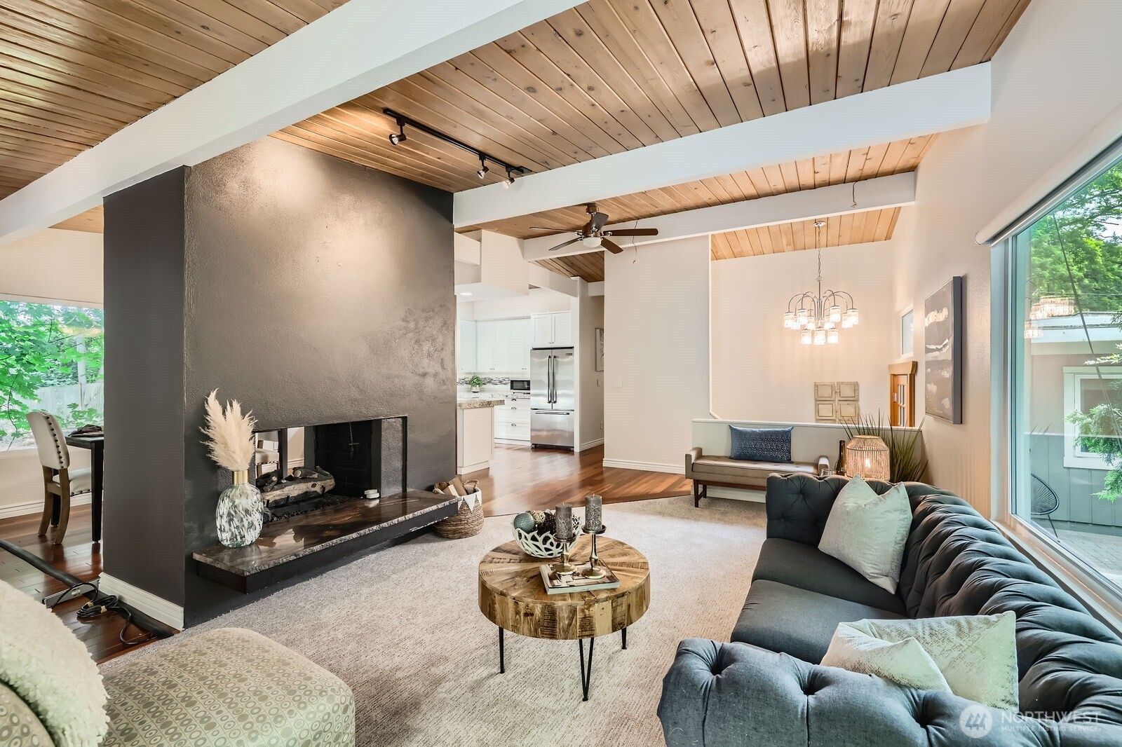 The dual-sided fireplace offers warmth to both the living and dining rooms