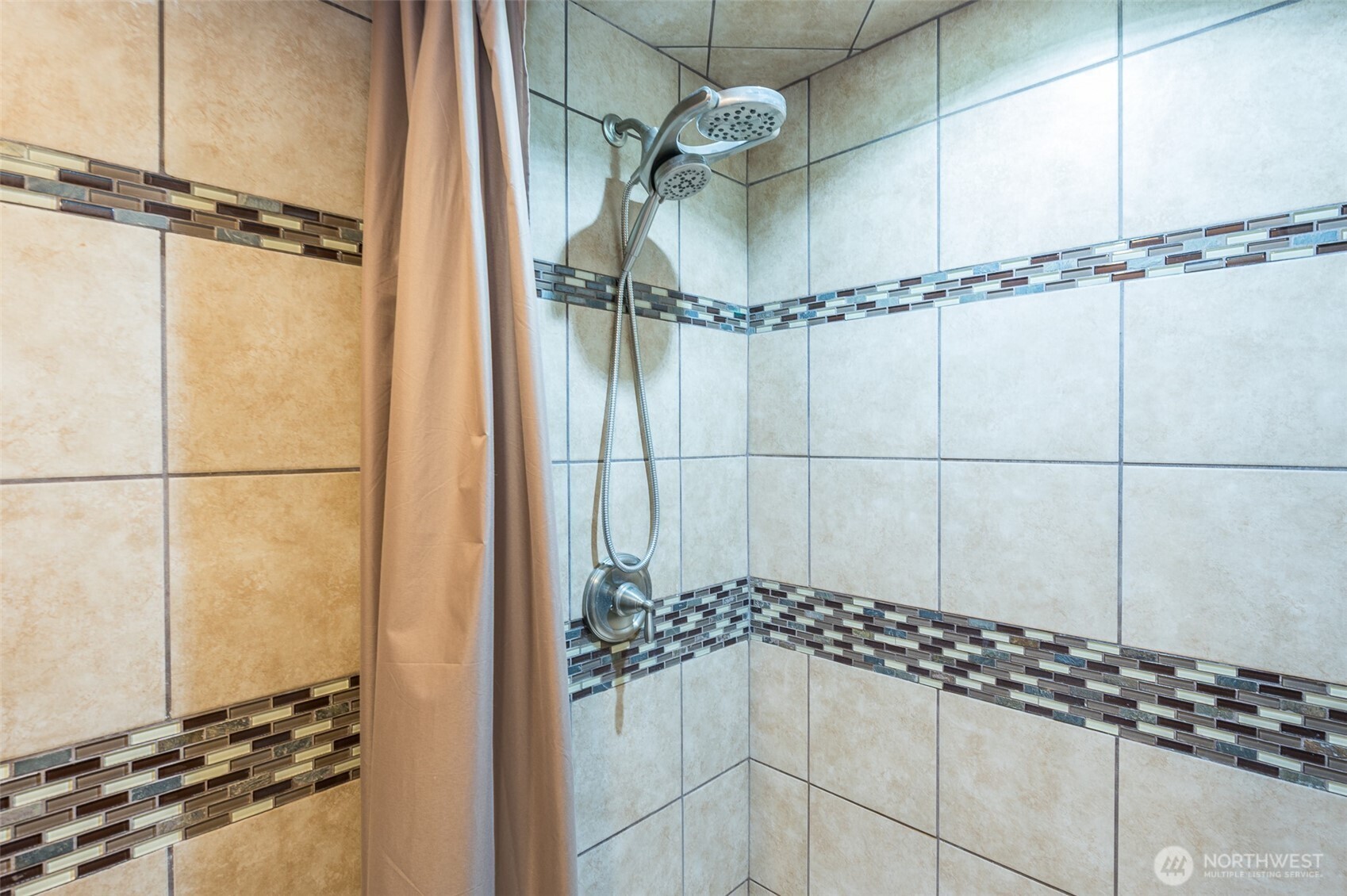 Fully tiled walk in shower.