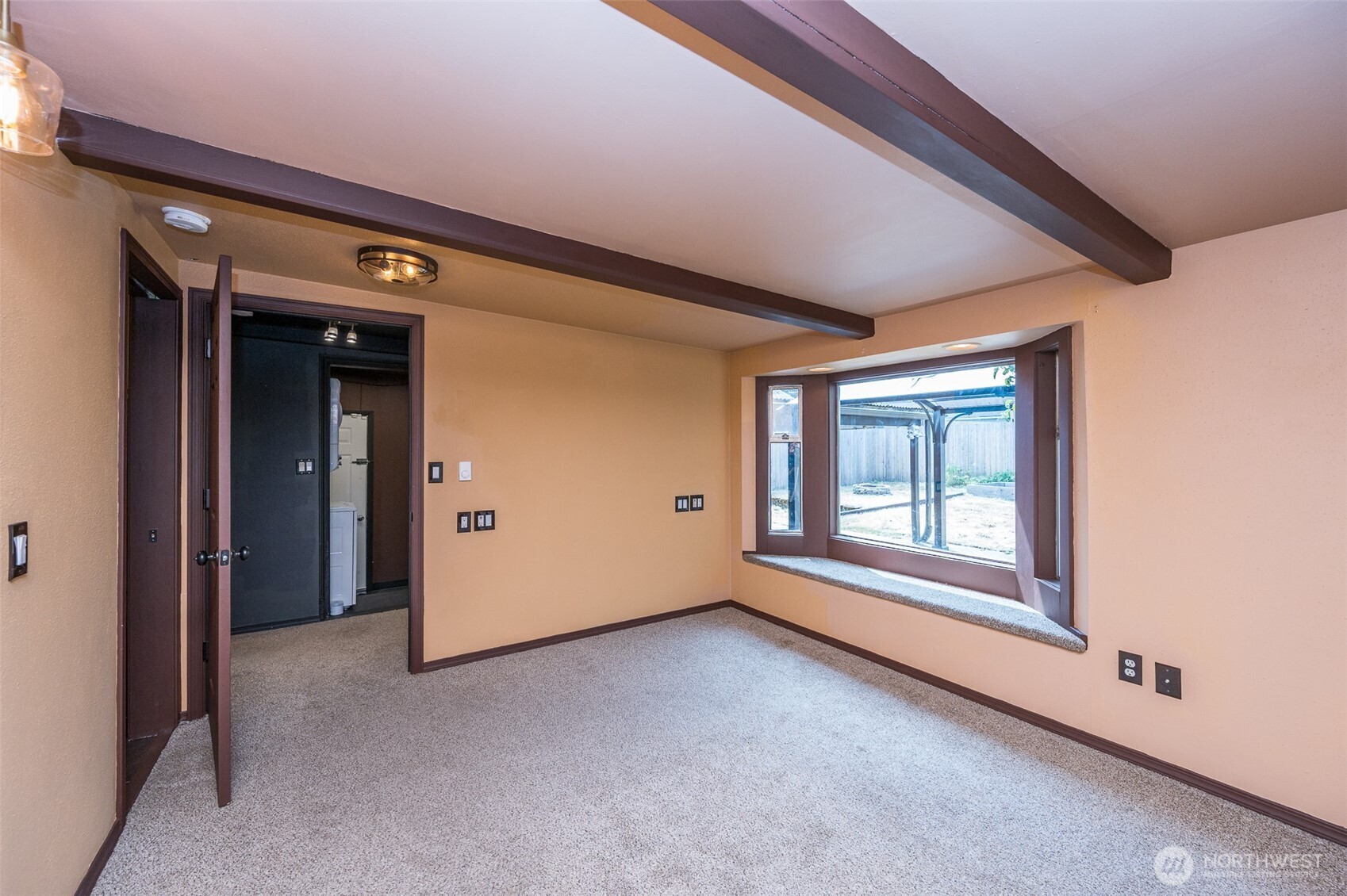 Master suite has exposed beams, updated lighting,bay window to enjoy, full room length closet.