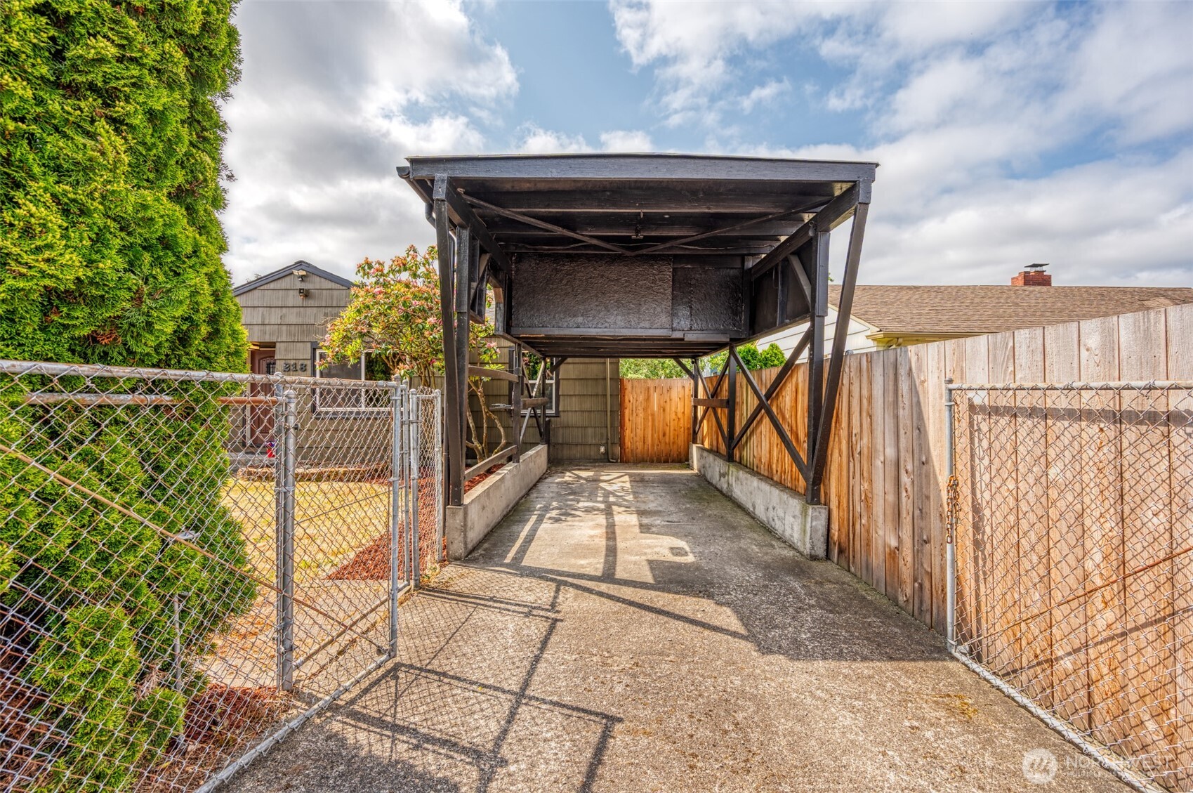 RV carport with storage give options! has storage above and electrical, has a secondary gate.