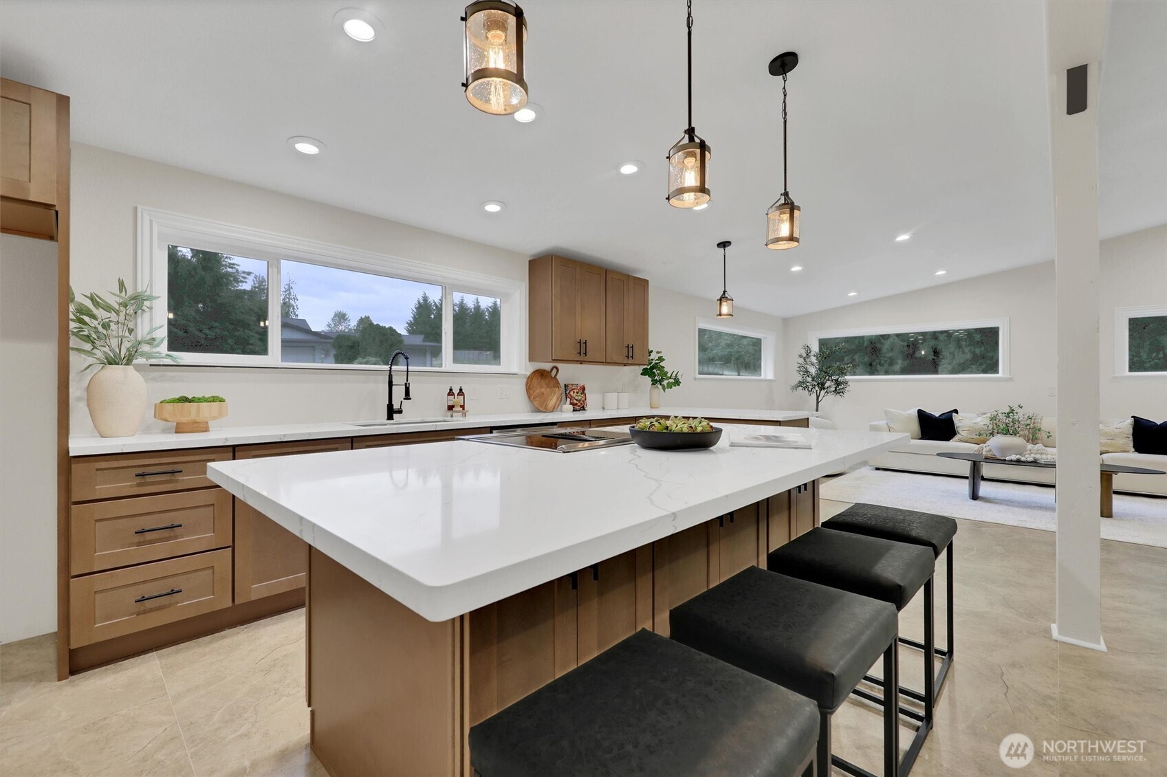 Modern kitchen with sleek new quarts, new cabinets with room to gather.