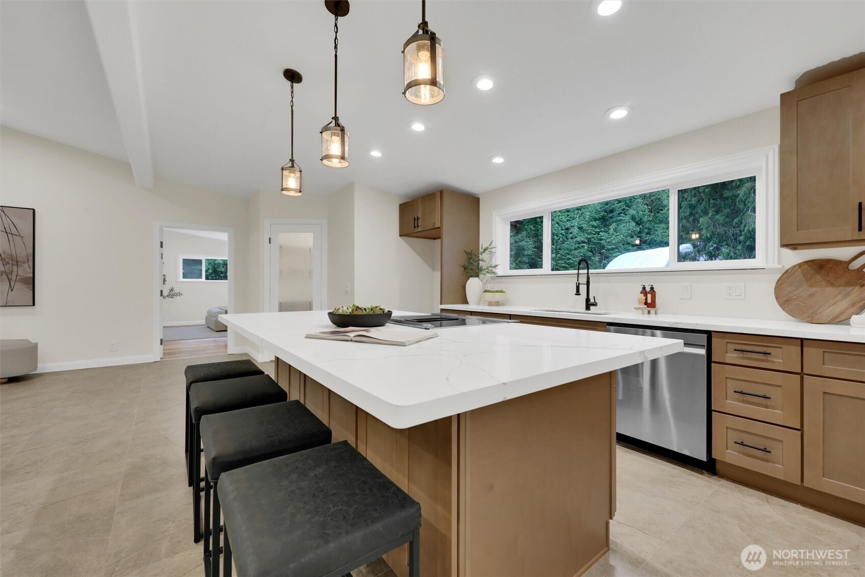 The updated kitchen combines style and function with modern appliances and finishes.