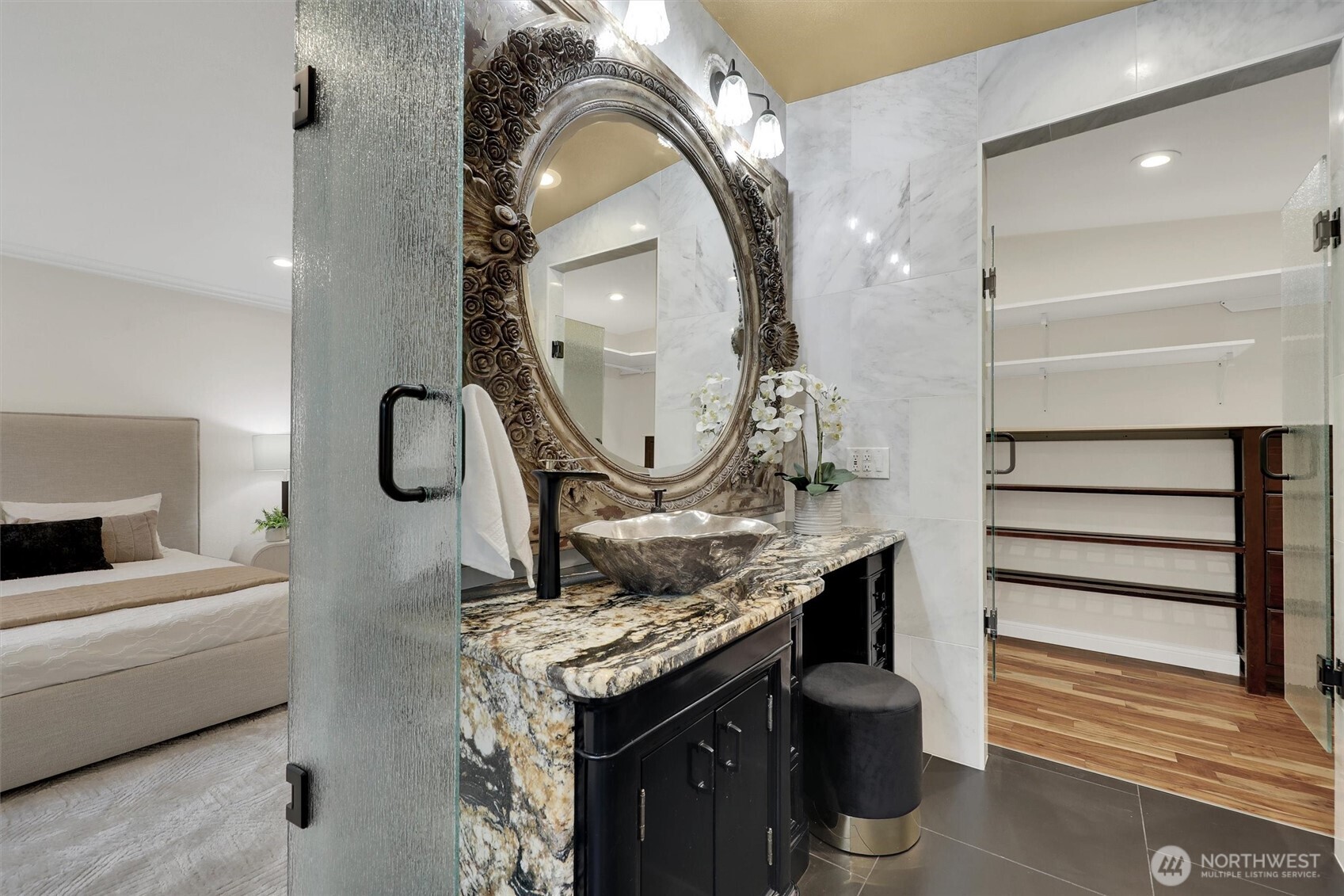Primary suite bathroom is spacious with exquisite touches.
