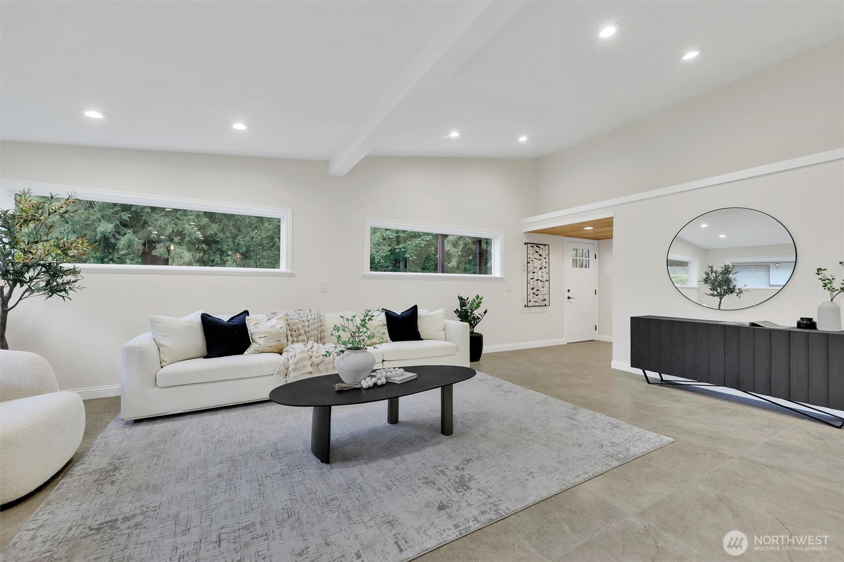 Bright and open living room with new flooring and paint.