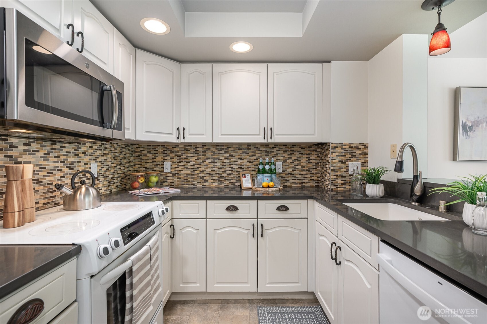 A closer look reveals classic finishes and abundant cabinetry, with ample counter space.