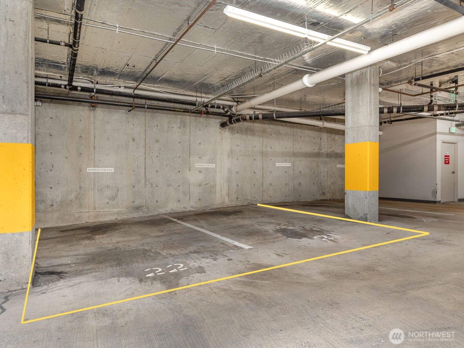 This unit includes two secure, deeded parking spaces—Spaces 21 and 22—a rare amenity in Downtown Bellevue, complete with door ding protection thanks to the structural post on both sides.
