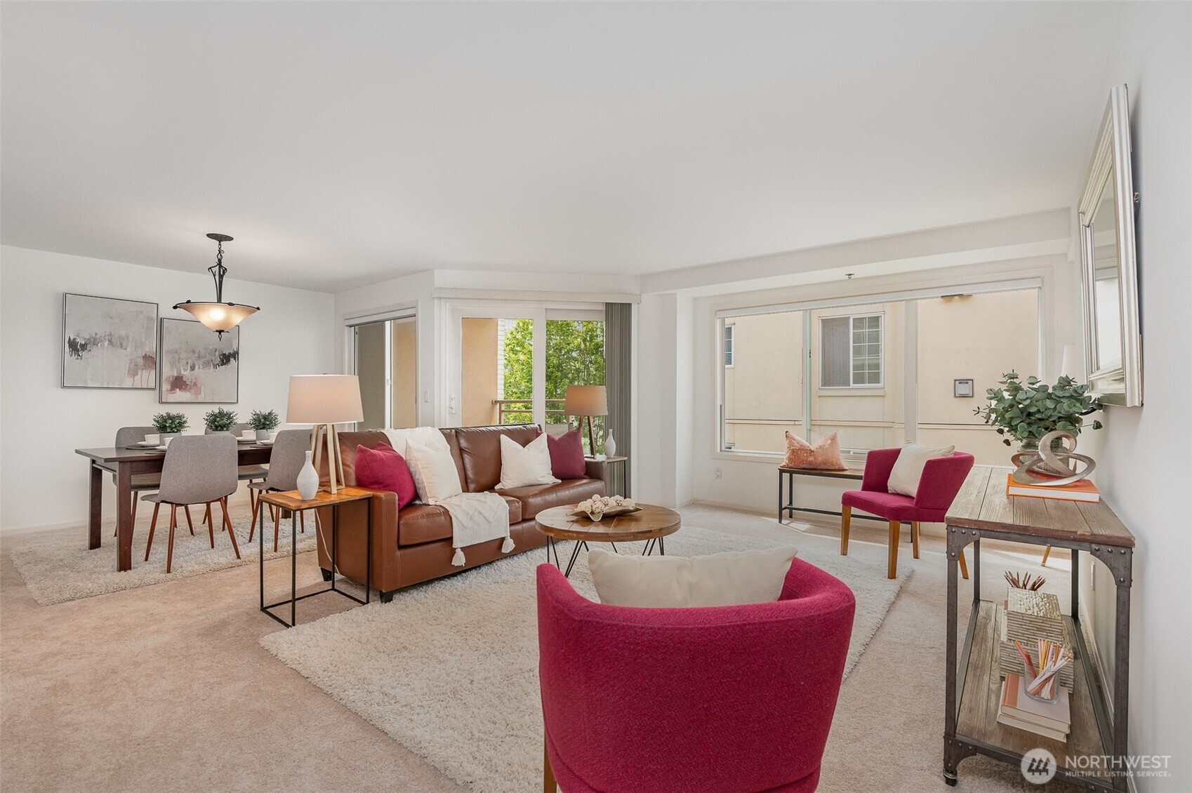 Enjoy a corner-unit layout with an open-concept design that seamlessly blends the living and dining spaces. Fresh paint, plush carpeting, and abundant natural light streaming in from multiple exposures create a warm and inviting atmosphere.