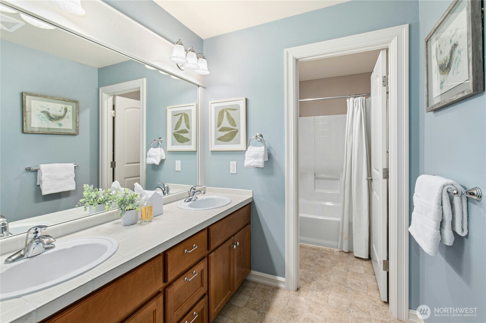 Upper Level - Hall bath with double sink and separate wet room.