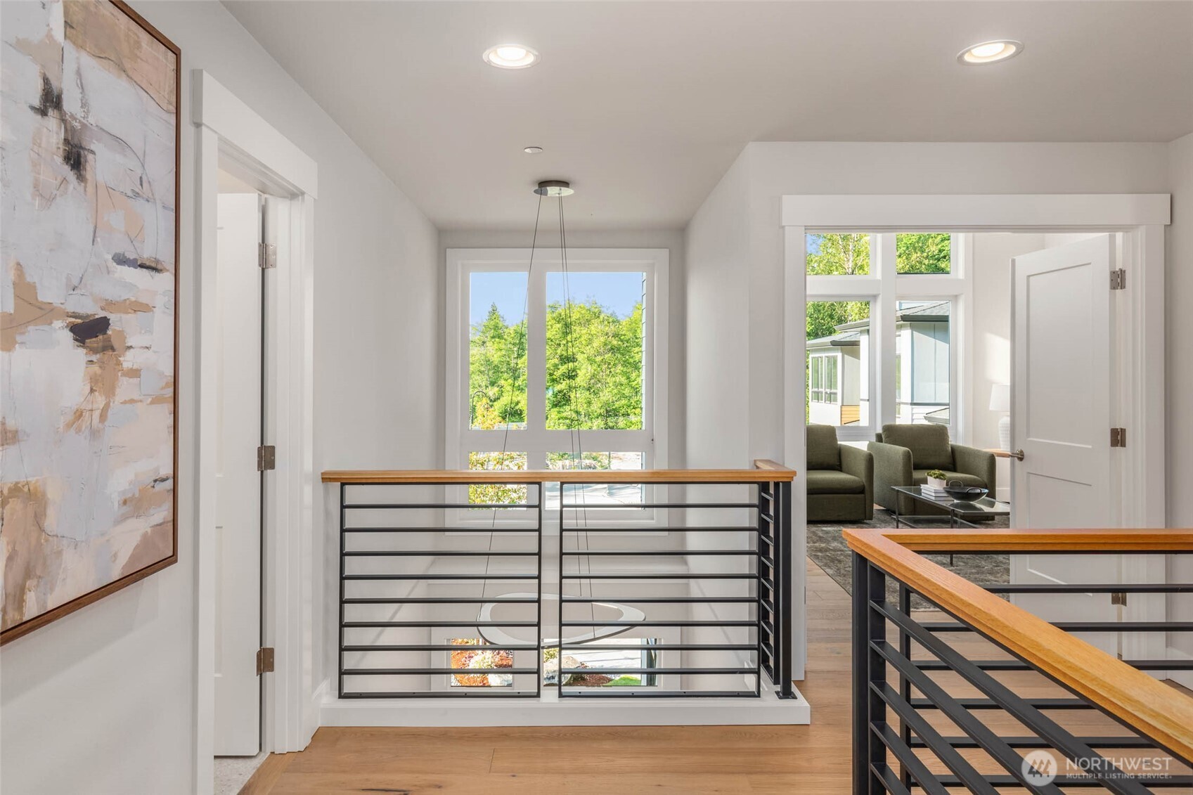 Open Rail system and wide plank hardwood flooring create a bright and luxurious flow throughout the second floor