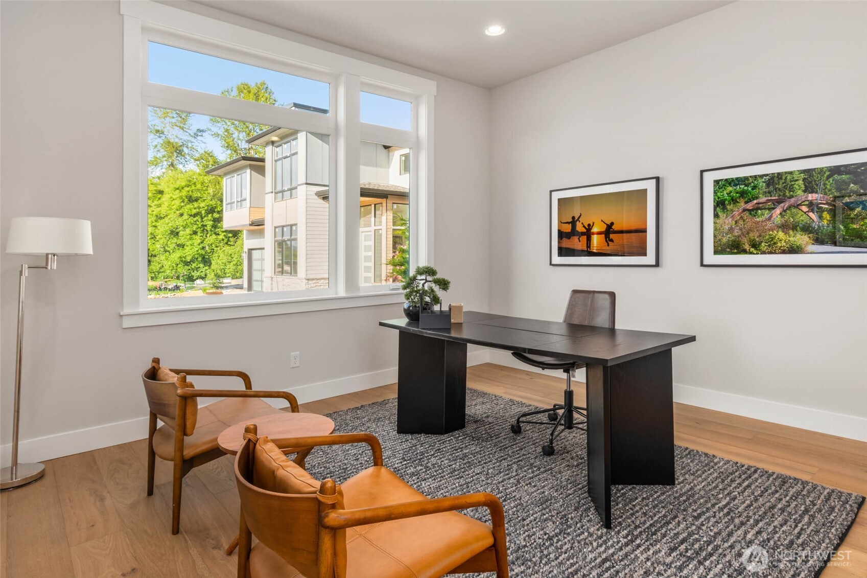 Main floor office features wide plank hardwood floors, closet, and is conveniently located near 3/4 bath and can be utilized as guest suite if desired