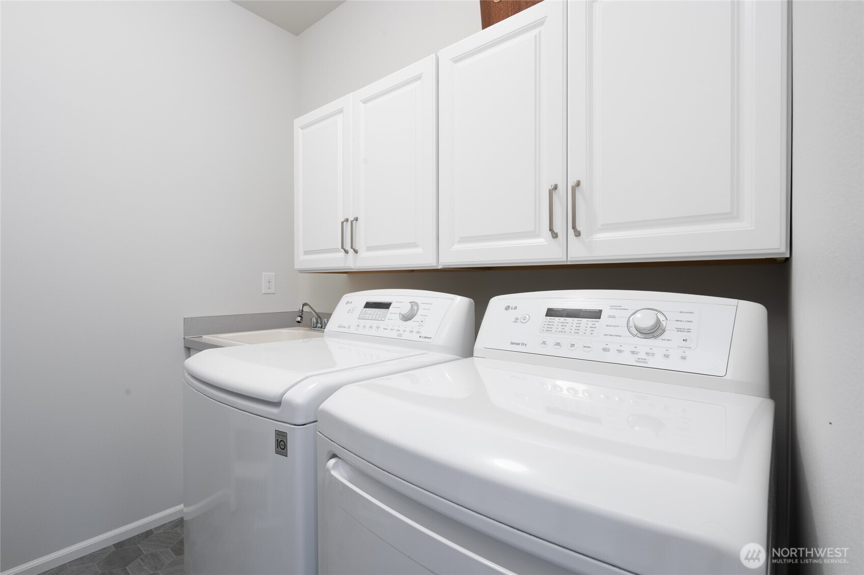 Laundry room with storage.