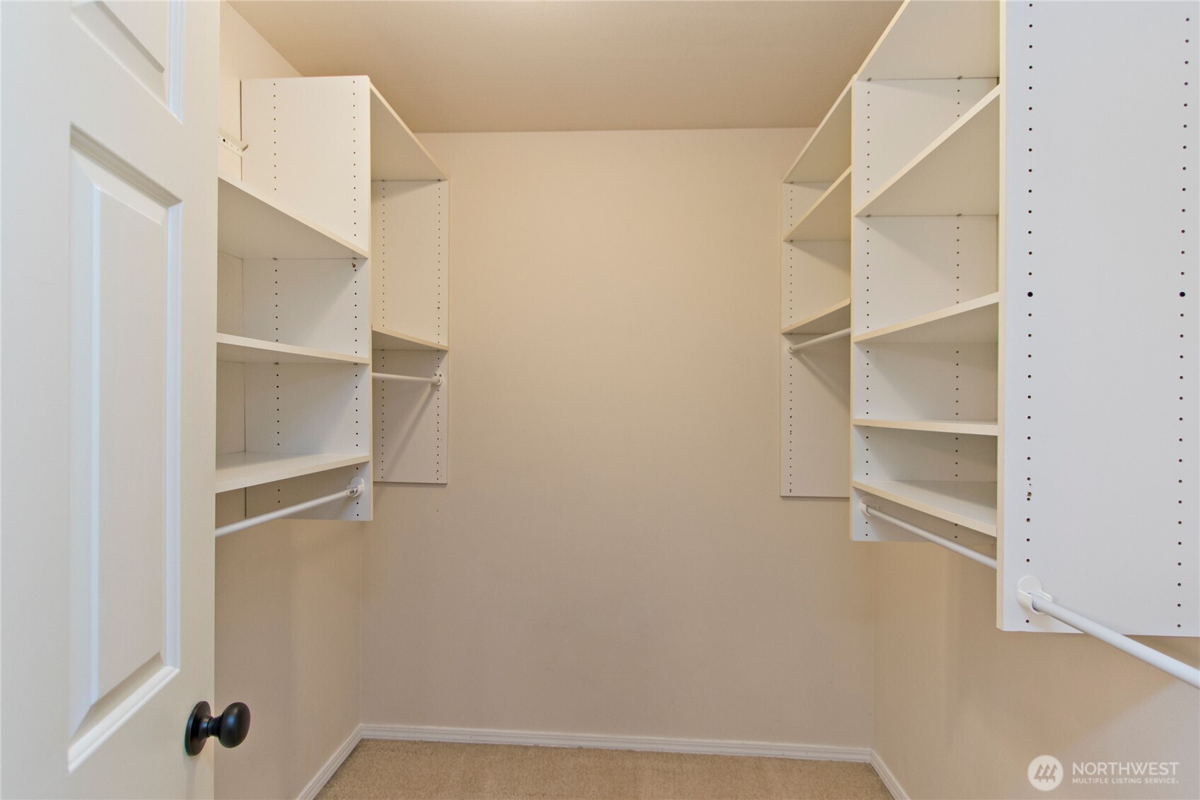 Primary bedroom walk in closet
