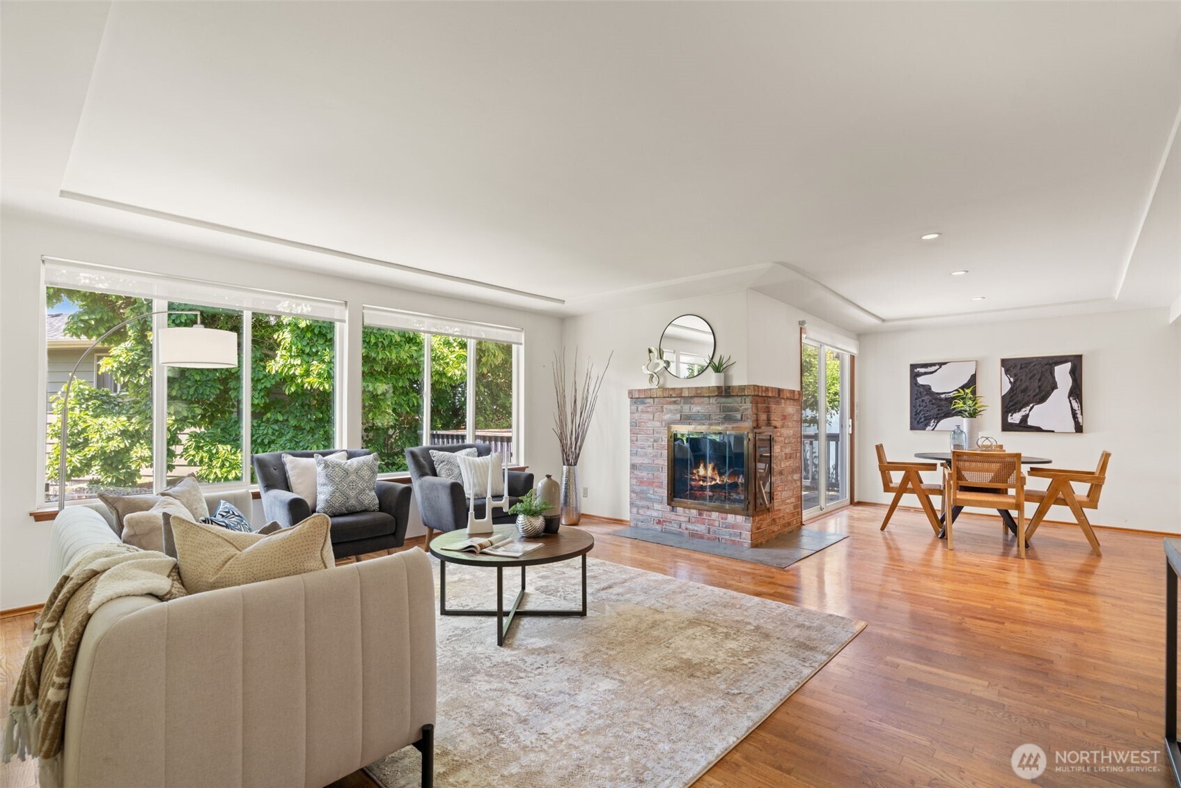 Living room with hardwood floors and fireplace.