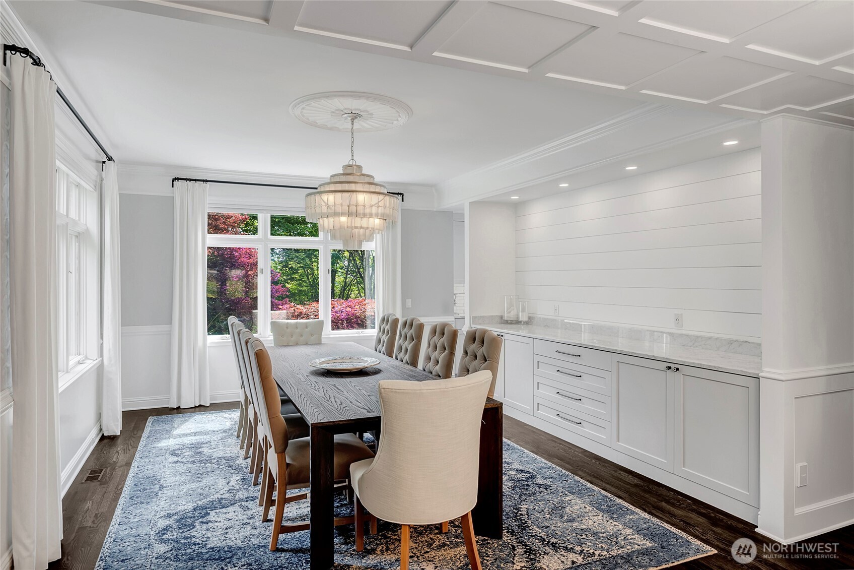 The dining room provides an elegant and peaceful retreat for formal meals, and is connected to the kitchen by a fully equipped butler’s pantry.