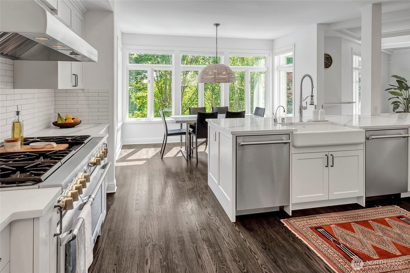 The heart of the home is a stunning chef’s kitchen, featuring a 48-inch Thermador range, oversized refrigerator and freezer columns, dual dishwashers, breakfast nook and a custom wrap around quartz countertop.