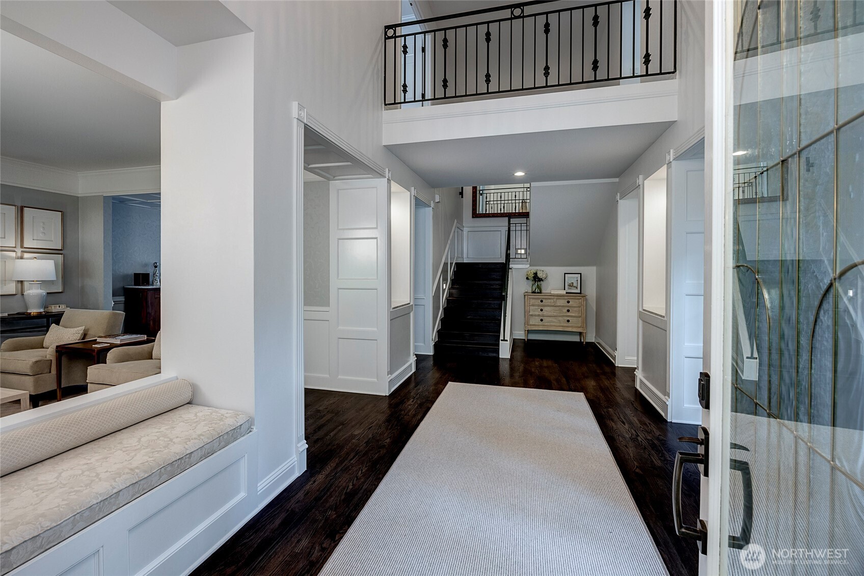 Upon entry, soaring ceilings and gorgeous dark hardwoods contrast the beautiful millwork to create warmth from the minute you step inside.