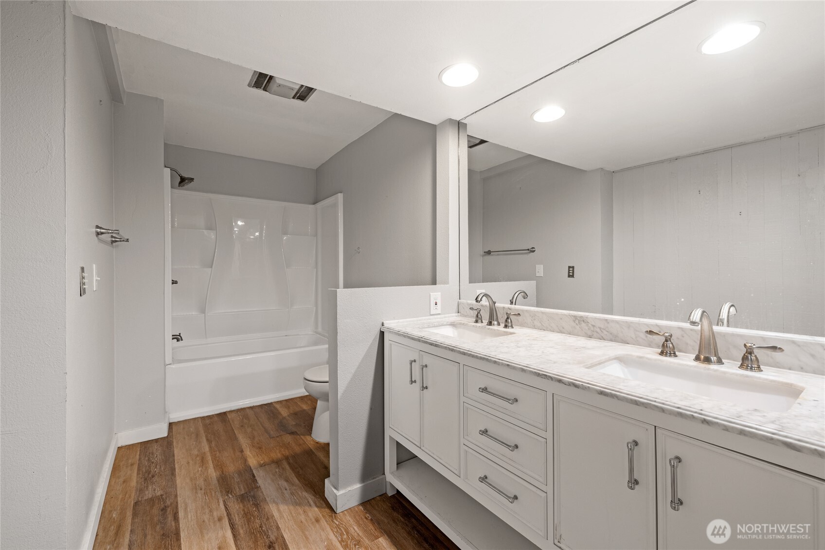 Updated bathroom with dual vanity.