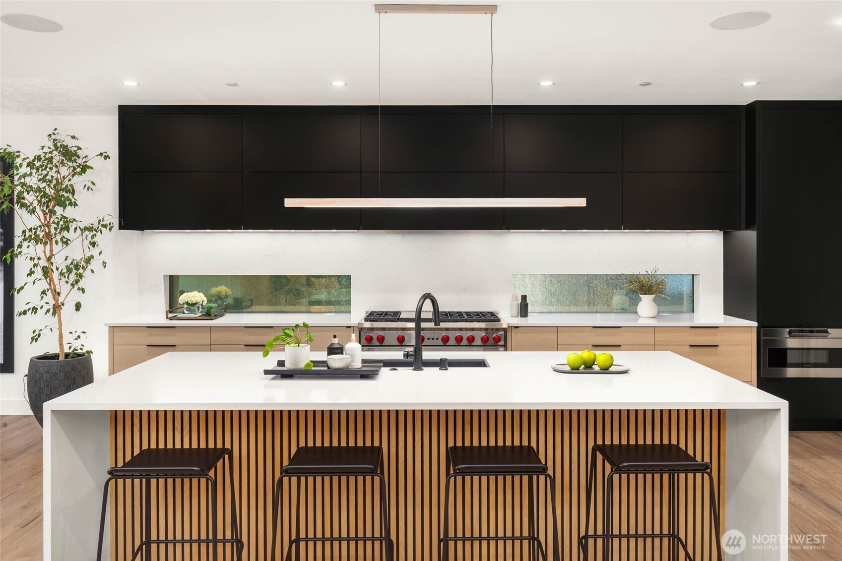 The gourmet kitchen is outfitted with Wolf and Sub-Zero appliances.