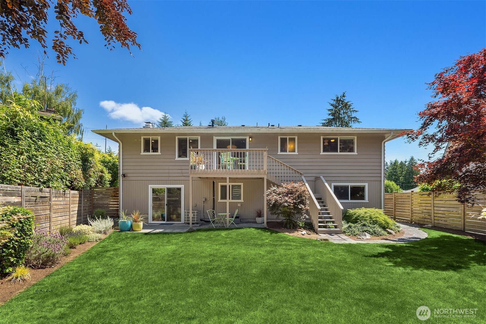 Big, level backyard with deck.