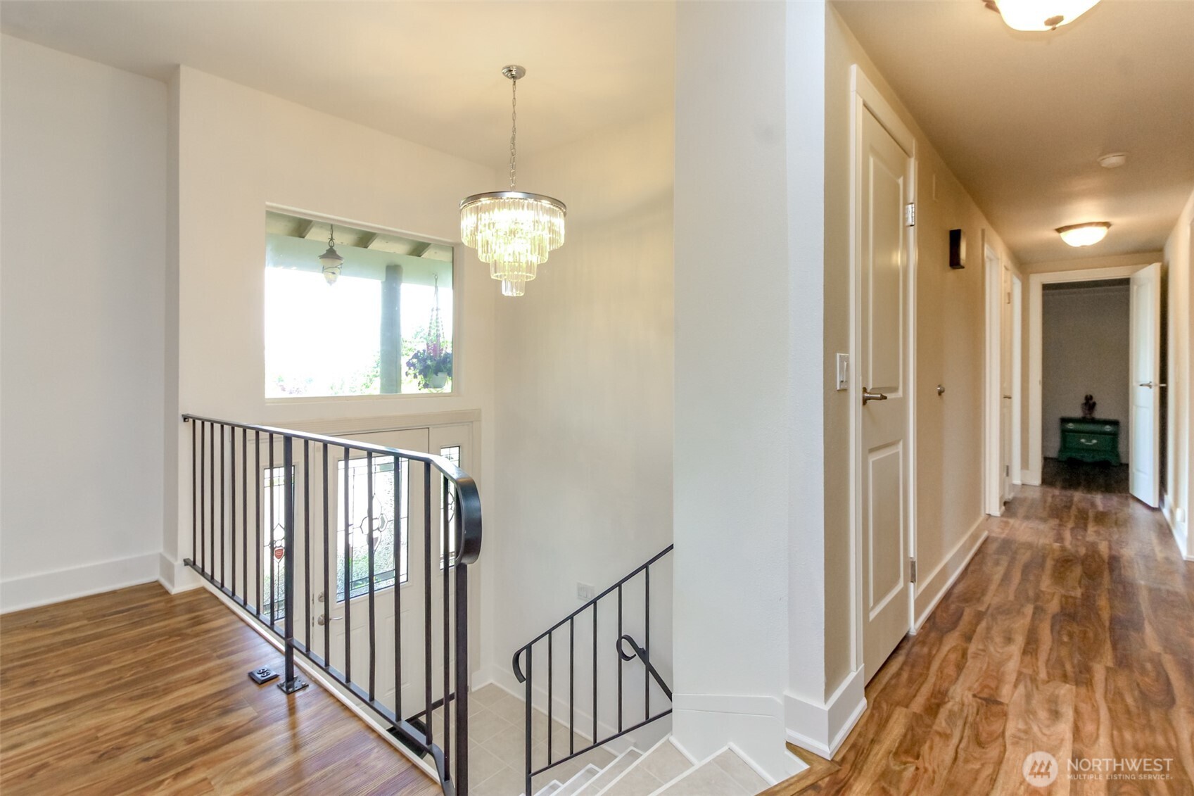Hallway to Bedrooms. Stairs to entry and lower level.