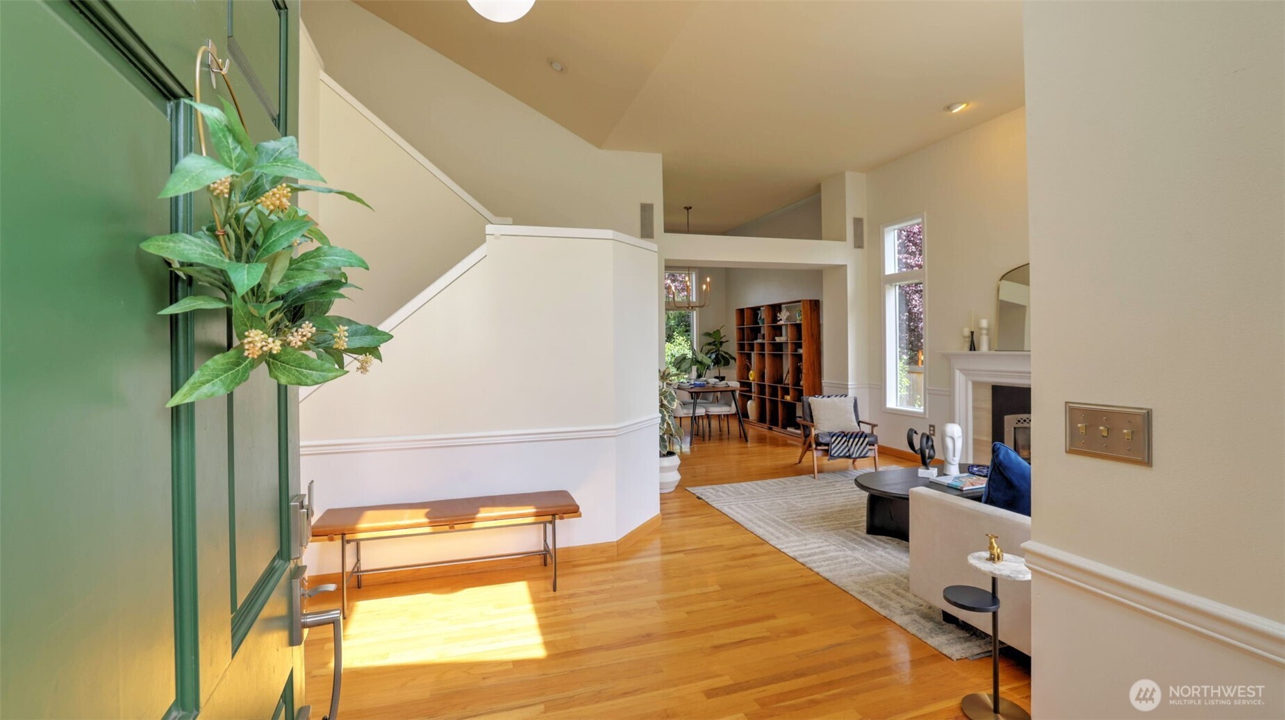 Step inside to gleaming hardwood floors and a spacious open-concept layout that offers effortless flow from the moment you enter. Vaulted ceilings and stylish design elements are showcased throughout the home, creating a bright and elegant atmosphere!