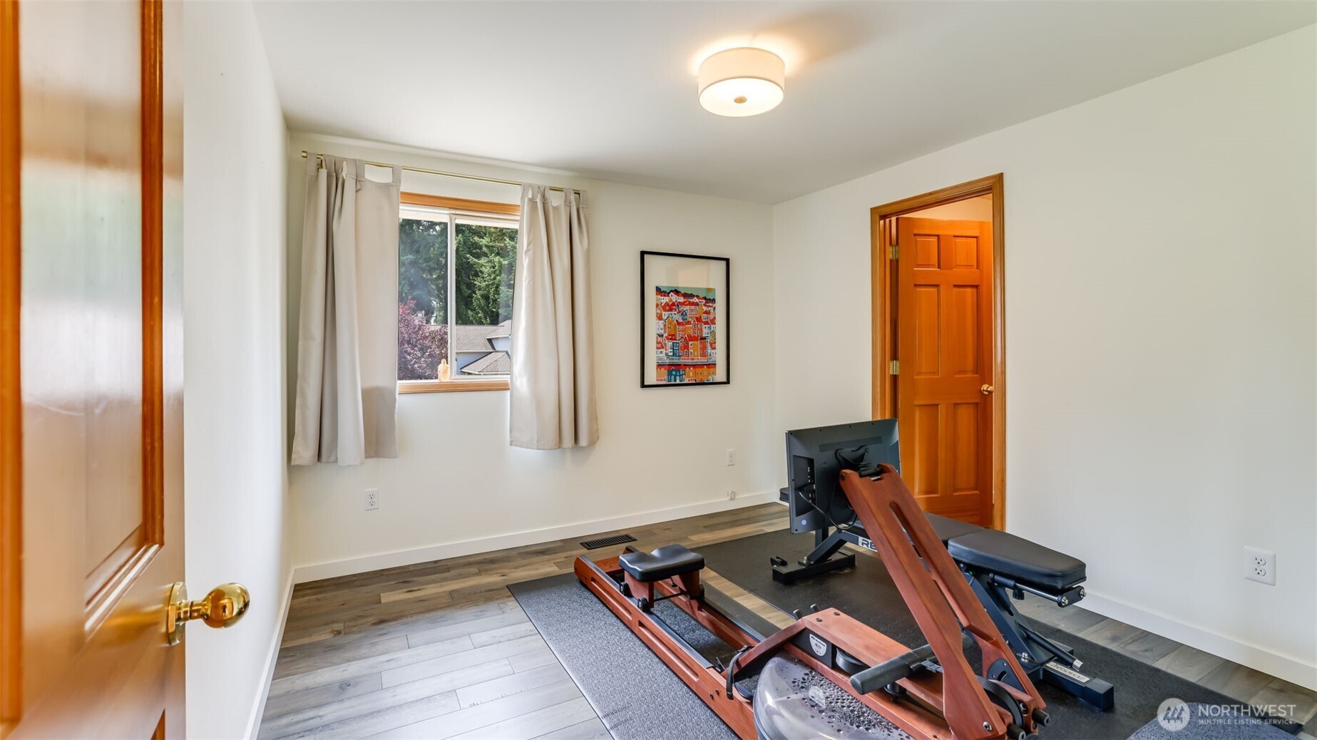 Bedroom #2 offers ample closet space and elegant wood flooring throughout