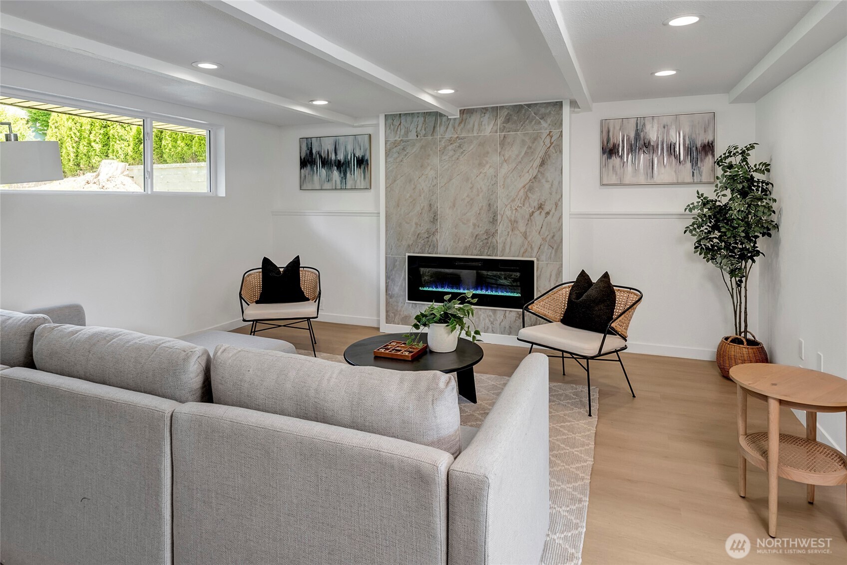 Lower level living room with electric fireplace.