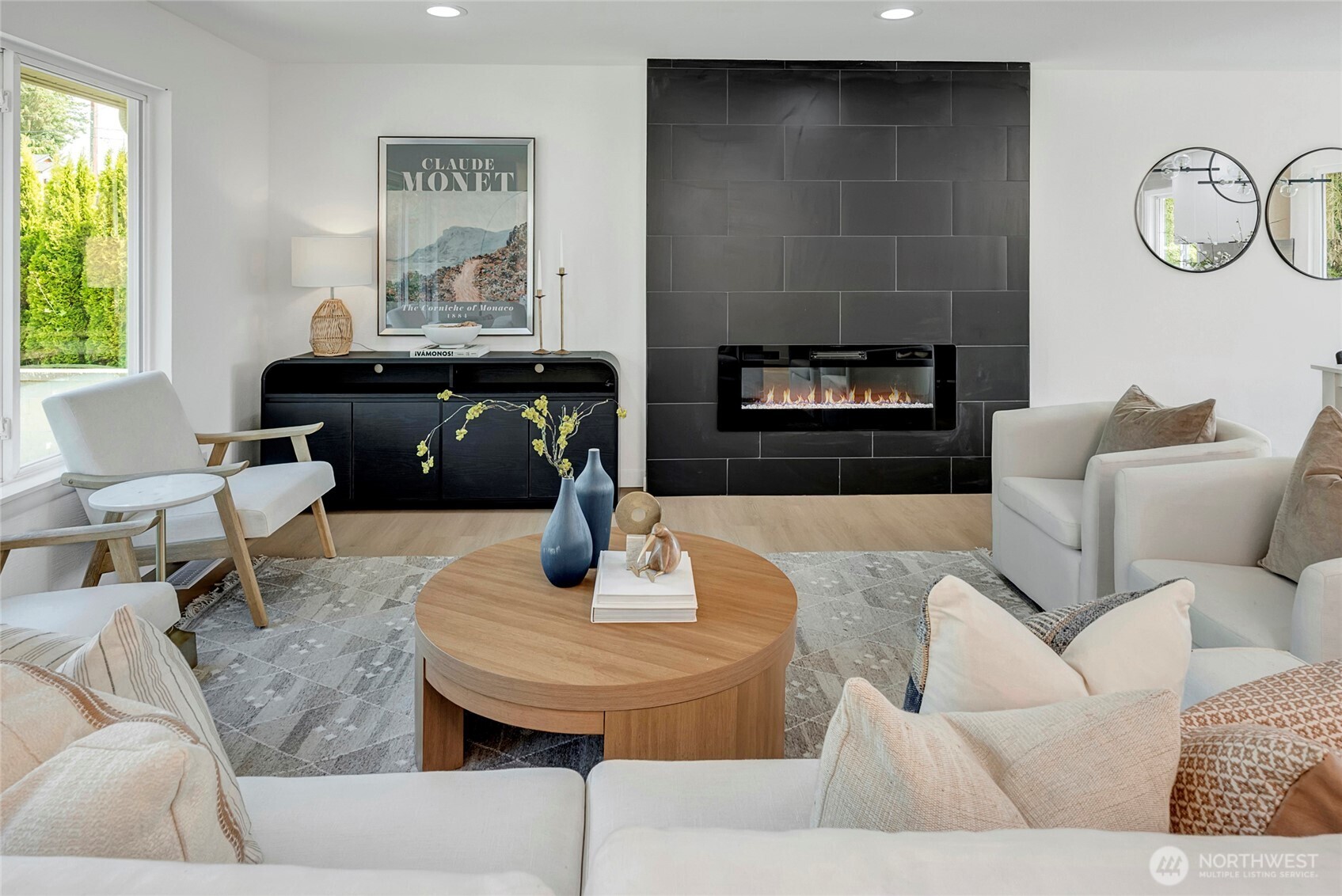Open concept family room with electric fireplace.
