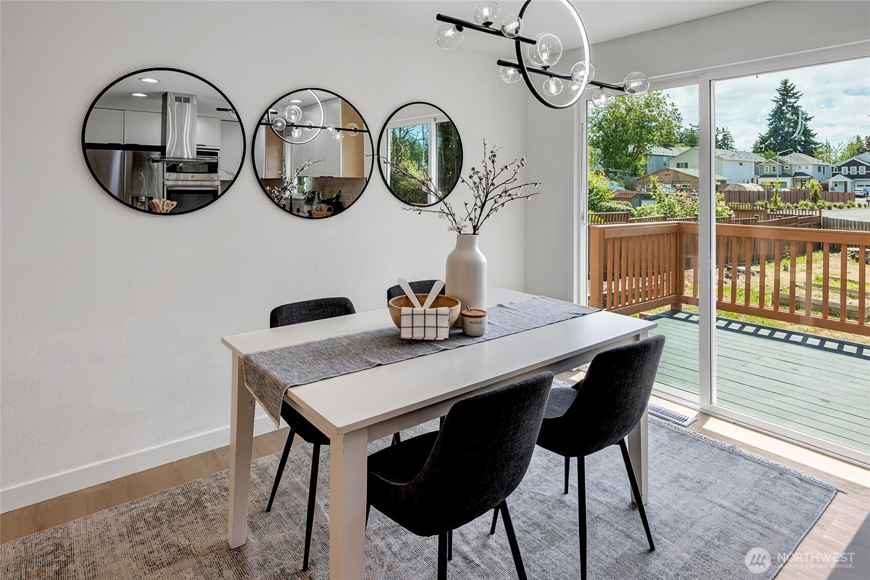 Dining room with slider that opens to large deck.